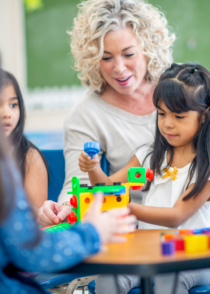 Teacher working with Kindergarten Students